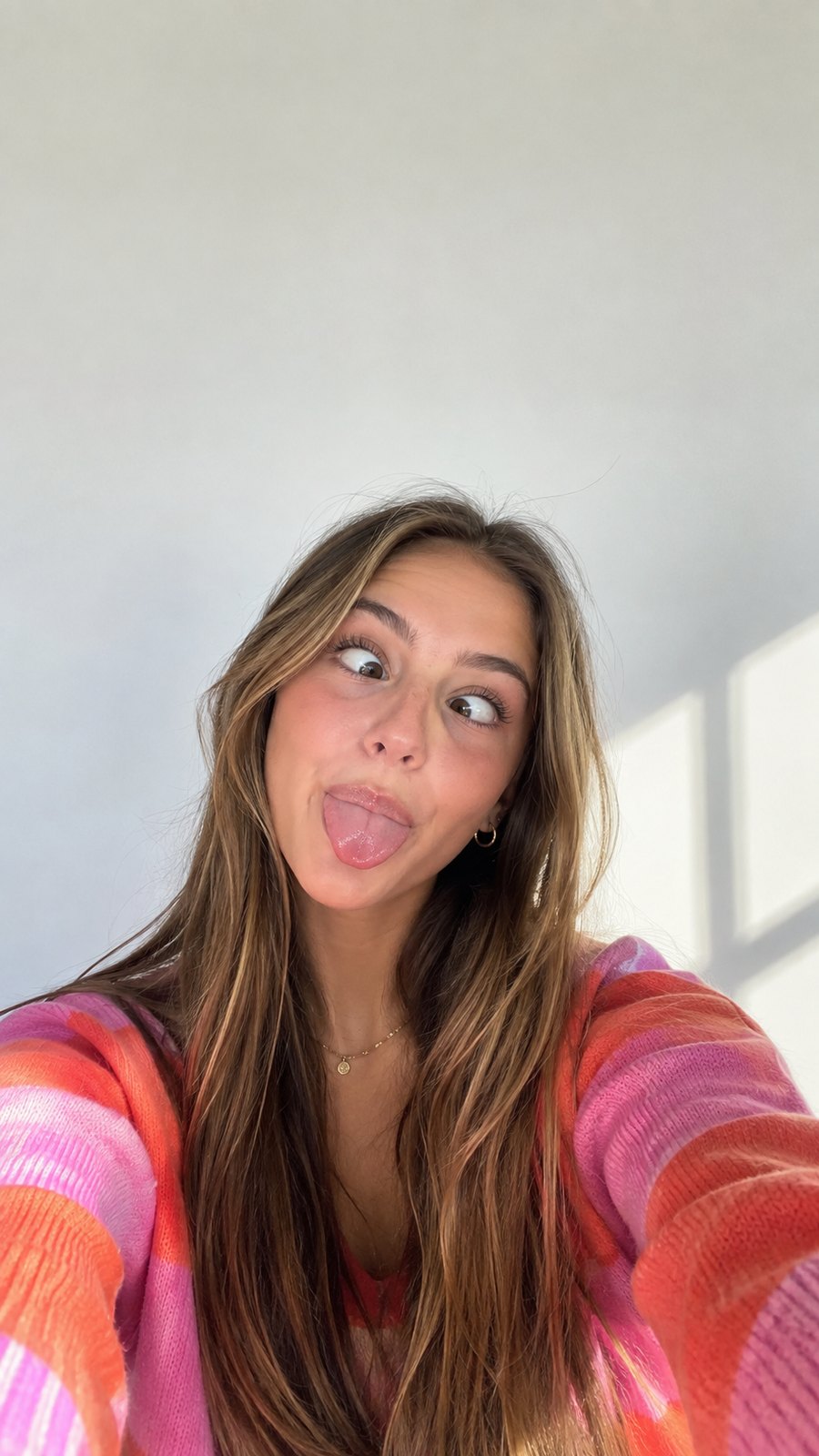 A friend pulling a funny face, set as the Lock Screen wallpaper